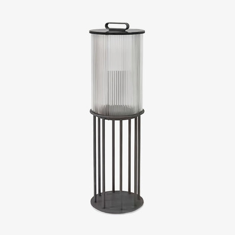 Fluted glass lantern with black bands and a tall four leg floor stand