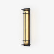 Tall wall lantern with a pale veined panel in a black cross bar frame