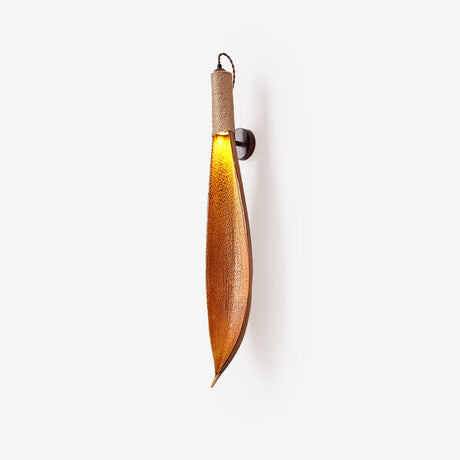 The leaf sconce in profile on a pale ground, the light at the top of the leaf