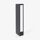 Slim dark bollard with a tall lit slot running down the front face