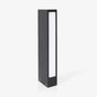 Slim dark bollard with a tall lit slot running down the front face