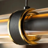 Close view of the metal collar holding the lit tube inside the glass