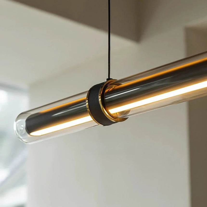 Close view of the lit tube inside its clear glass sleeve