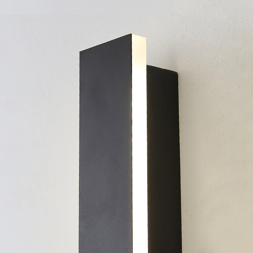 The light edge of the black strip seen from the side, the glow running its length