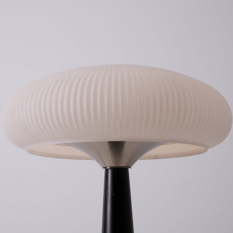 Close view of the flutes running around the opal glass shade