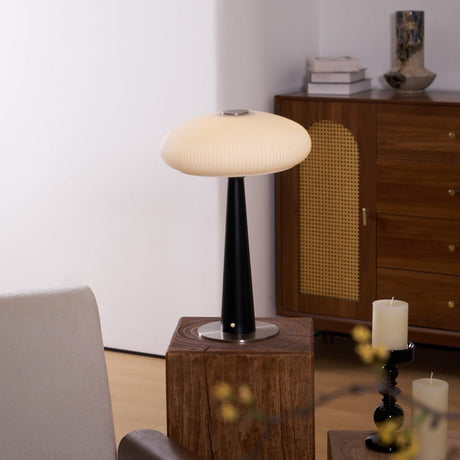 LED table lamp lit and seen in full against a plain ground
