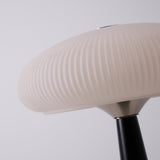 Close view of the opal glass shade seen from below the flutes