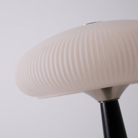 Close view of the opal glass shade seen from below the flutes