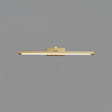 The brass version seen straight on, a thin lit bar on a short central arm