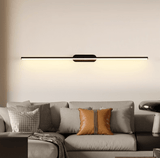 Thin rod lit above a pale sofa with cushions in a warm toned living room
