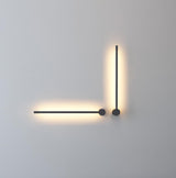 The two arm version lit in a corner, one arm horizontal and one vertical
