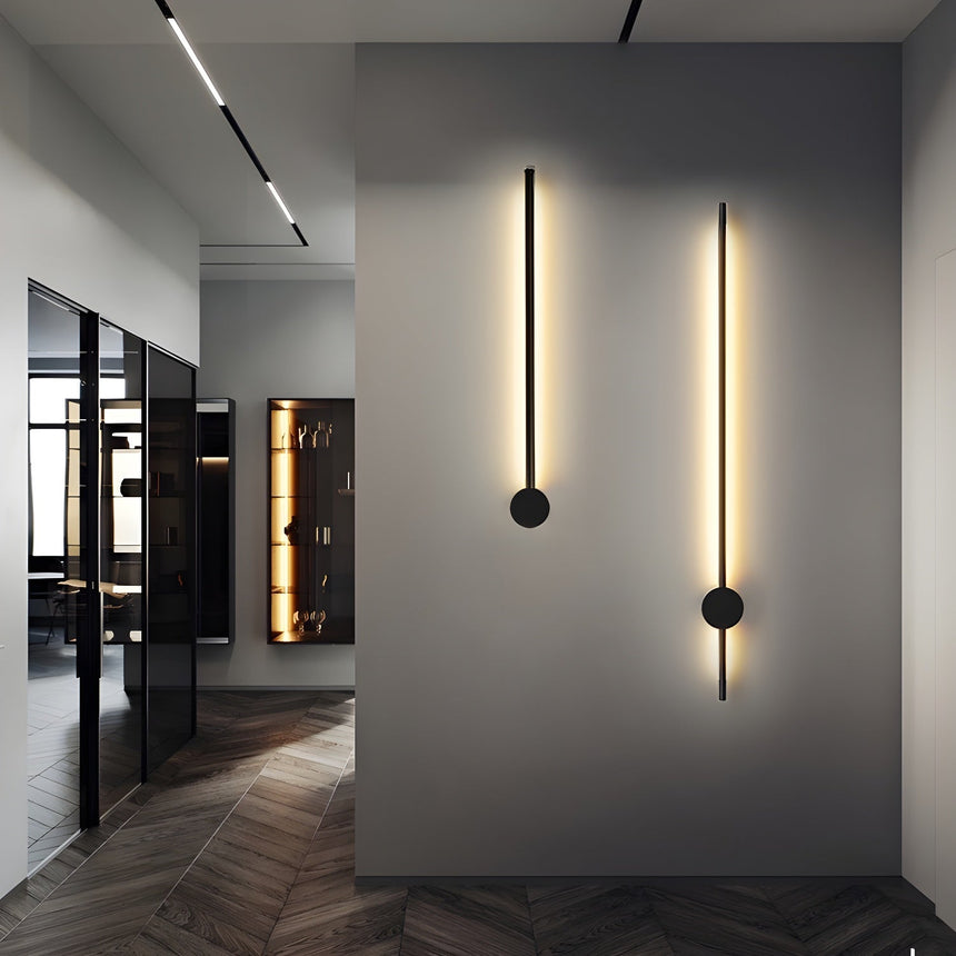 Two rods lit on a dark panel wall along a corridor with parquet underfoot