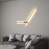 Lit above a gray sofa with cushions, one arm raised and one running level