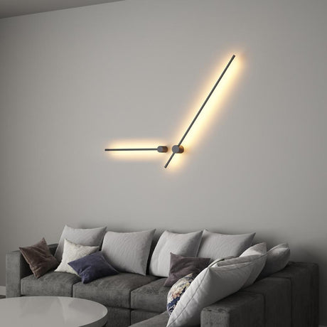 Lit above a gray sofa with cushions, one arm raised and one running level
