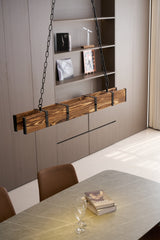 Lit over a long table beside wall shelving with a bright window at the end