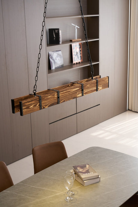 Lit over a long table beside wall shelving with a bright window at the end