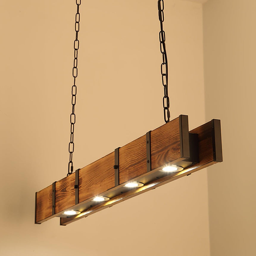 The beam lit against a warm wall, four round downlights showing in its underside