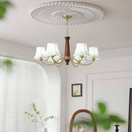 The fitting lit by a window blind above a chair and a side table