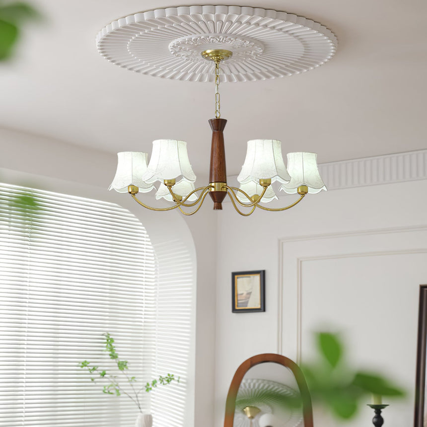 The fitting lit by a window blind above a chair and a side table