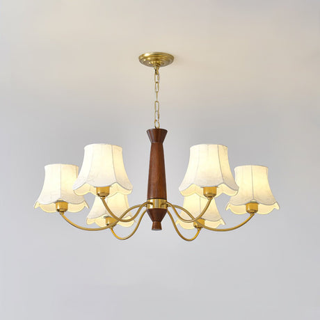 The walnut column and the brass collar the curved arms rise from