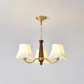 The three light build, brass arms and three fabric bell shades
