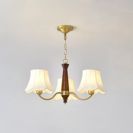 The three light build, brass arms and three fabric bell shades