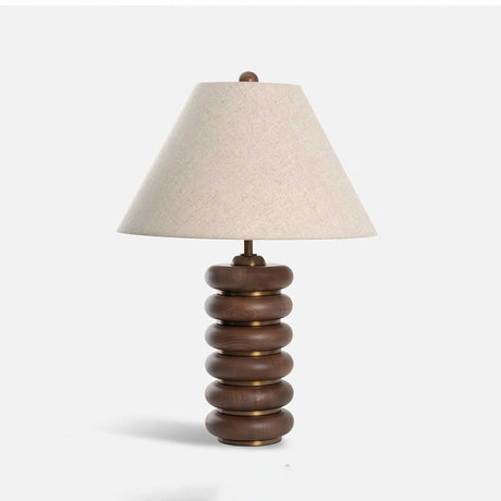 Linen shade table lamp unlit and seen at a slight angle