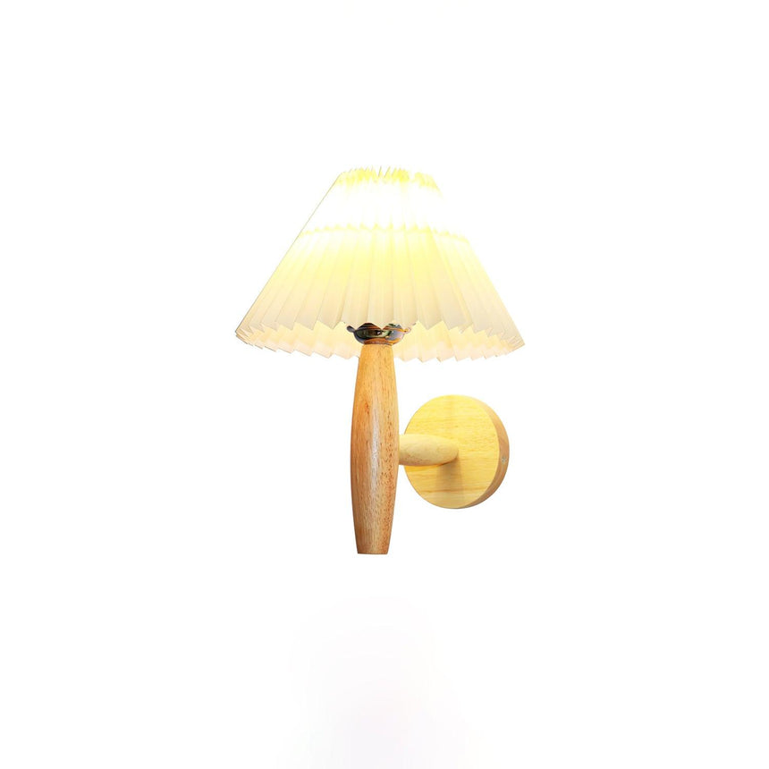 The sconce unlit on a pale wall showing the shade, arm and plate together