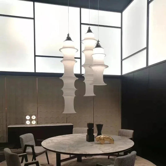 Three stacked silk columns hung over a round dining table