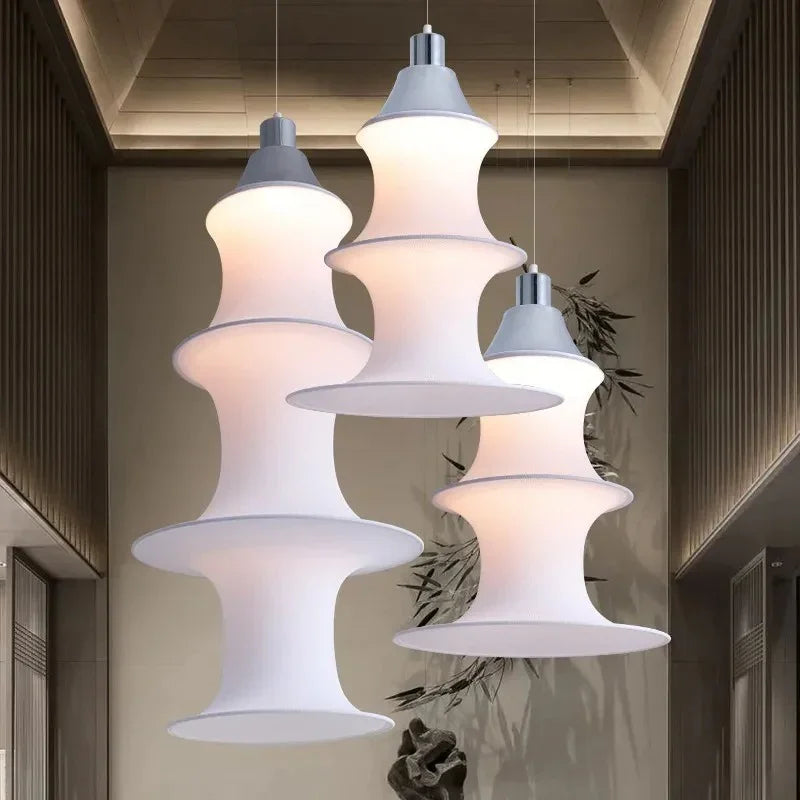 Group of stacked silk columns at three lengths seen together