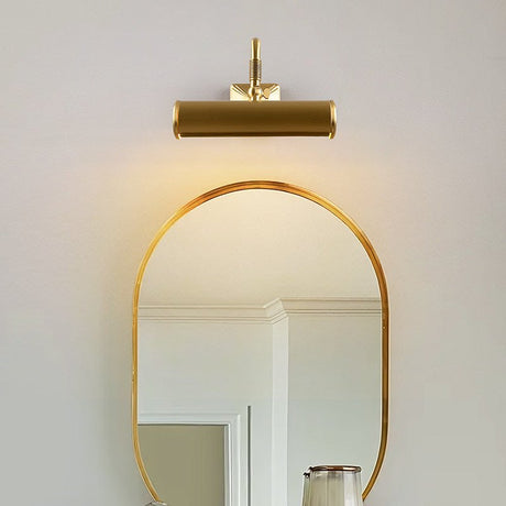 Brass tube lit above a tall arched mirror in a pale painted room