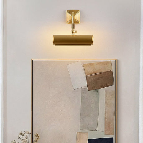 Brass tube lit over a large framed artwork resting above a console