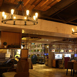 The ring lit above a counter in a room with a timber plank ceiling