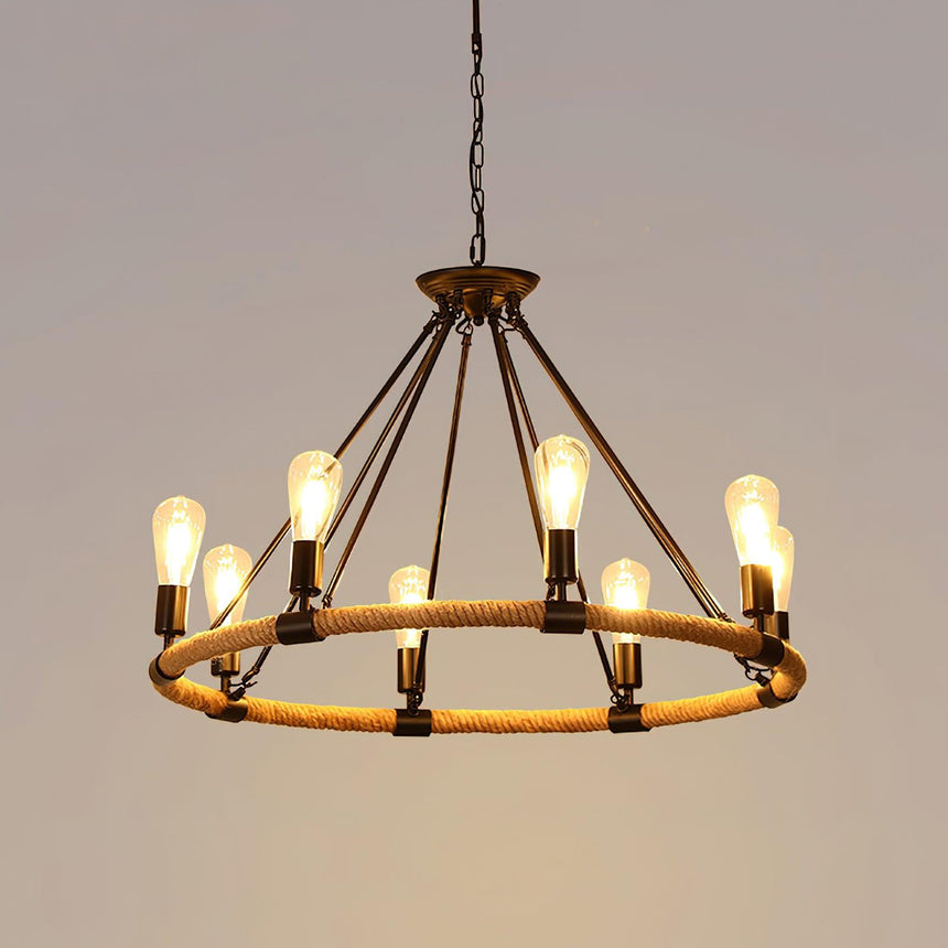 The eight light single tier lit warm, rope binding visible on the rim