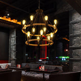 Two of the fittings lit in a dark lounge above low sofas and tables