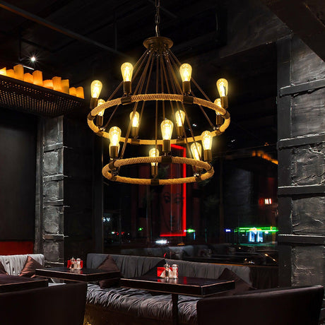 Two of the fittings lit in a dark lounge above low sofas and tables