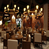 Several of the fittings lit across a tall room above dining tables