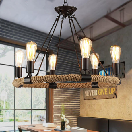 The lamps lit above a cafe table beside a window and a painted sign