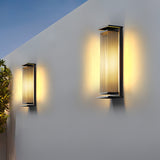 Two sizes lit on a white facade against a deep blue evening sky