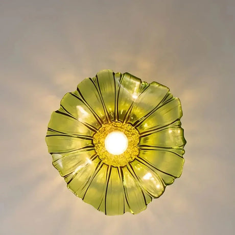 The green lotus shade seen from directly below with the bulb lit