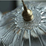 Close view of the shade rim where the petals meet the brass holder
