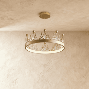 A shallow gold crown ring set with leaf shaped crystals, lit close to the ceiling
