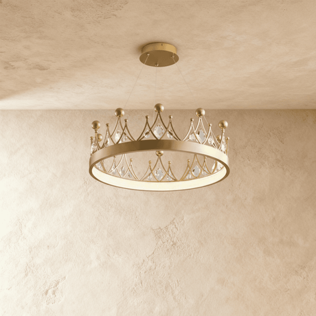 A shallow gold crown ring set with leaf shaped crystals, lit close to the ceiling