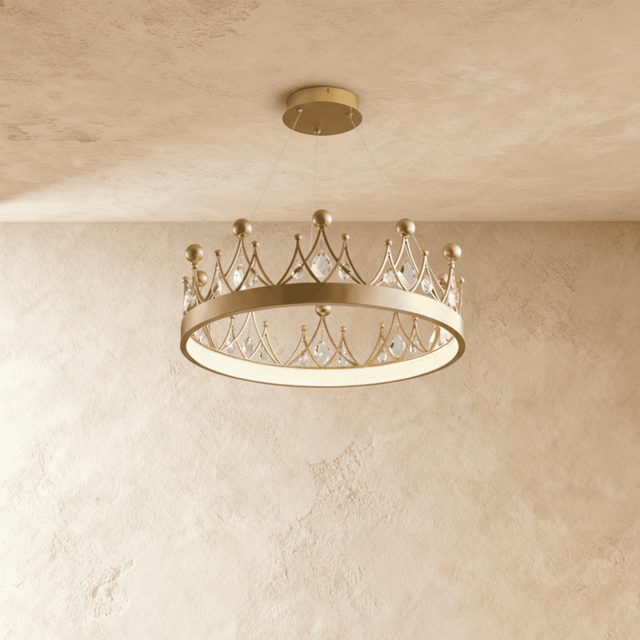 A shallow gold crown ring set with leaf shaped crystals, lit close to the ceiling