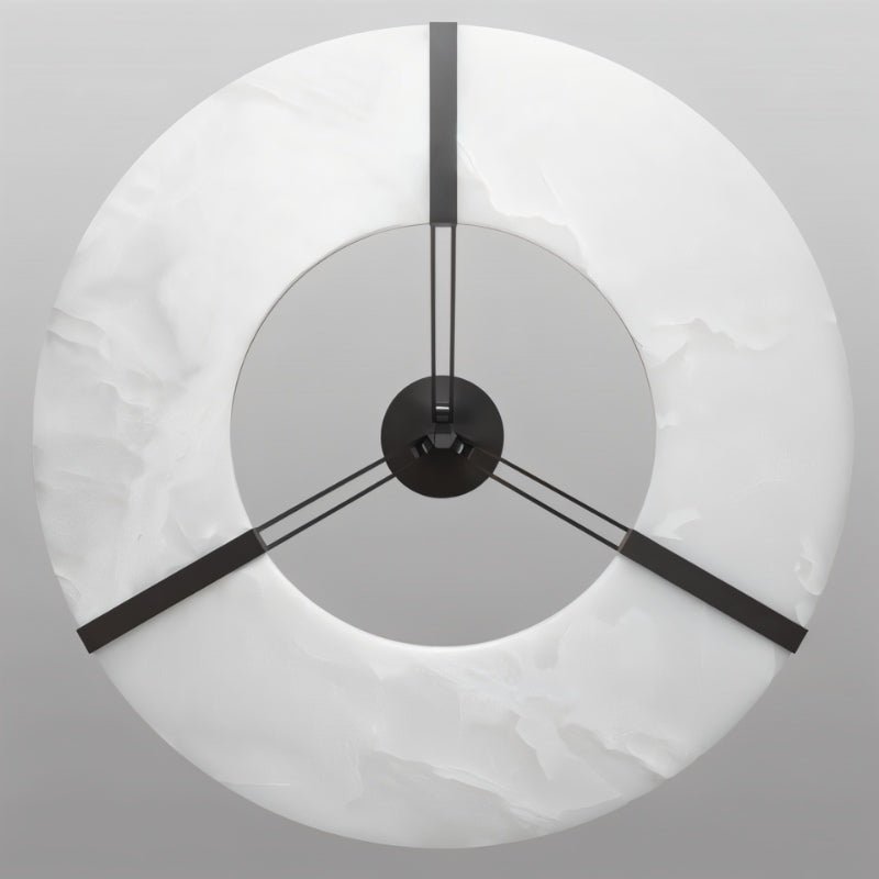 The ring viewed face on, three black straps running to the center
