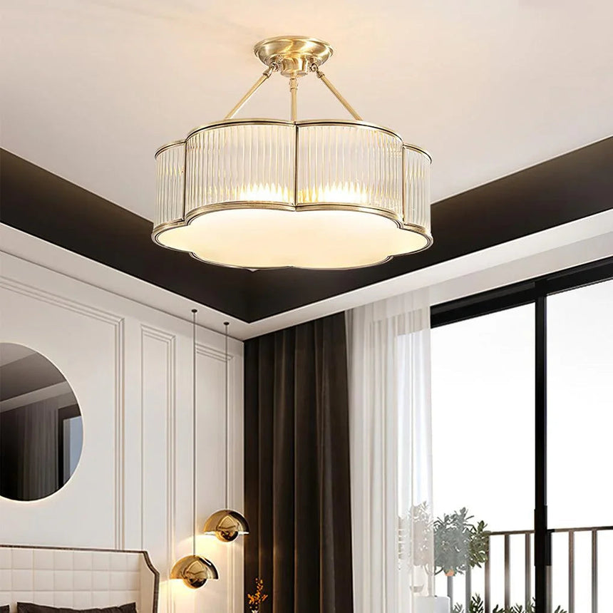 Lit drum in a dark lounge above a seating area with a tall window