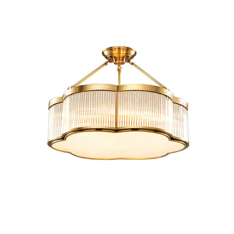 The brass and fluted glass drum seen on a plain white background