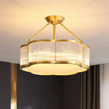 The fluted drum lit in a dark room with heavy curtains to one side