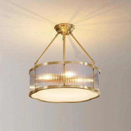 The drum throwing a warm ring of light onto a living room ceiling and walls