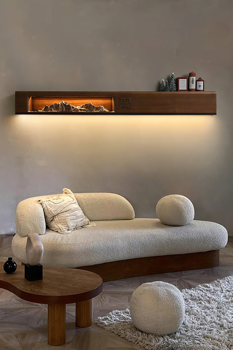 Light wood panel lit above a curved sofa in a plain living room